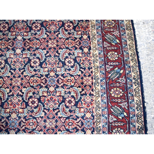 3143 - A Turkman red ground rug.  190cm x 140cm