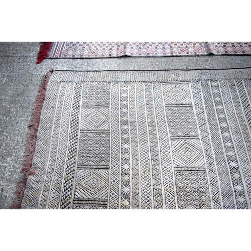 3145 - Two wool rugs.  290cm x 190cm