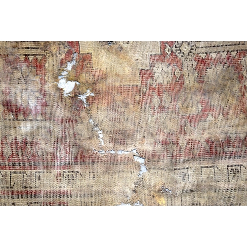 3153 - an antique Chinese rug fragment and a portion of another. (2)