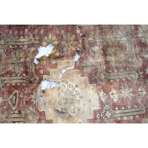 3153 - an antique Chinese rug fragment and a portion of another. (2)