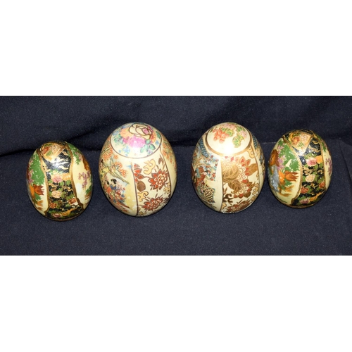 3165 - A group of oriental eggs, pottery tankard etc