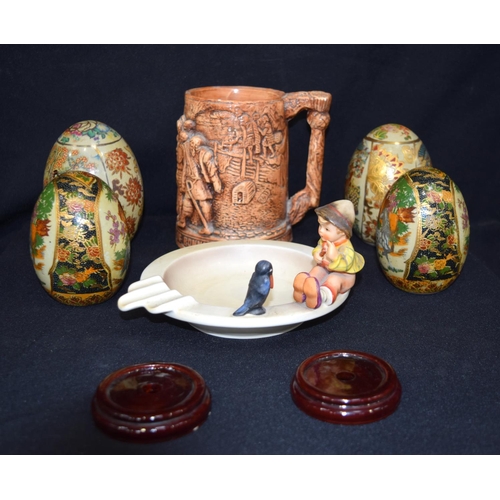 3165 - A group of oriental eggs, pottery tankard etc