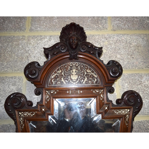 3182 - An Antique continental bevelled glass Mirror with wooden ivory inlaid frame.  108cm x 60cm