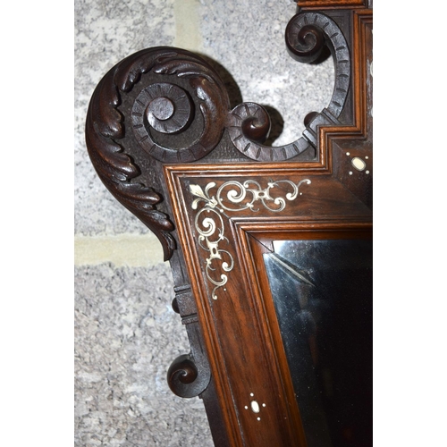 3182 - An Antique continental bevelled glass Mirror with wooden ivory inlaid frame.  108cm x 60cm