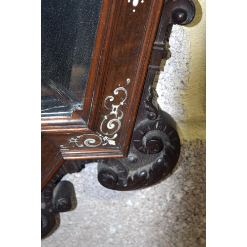 3182 - An Antique continental bevelled glass Mirror with wooden ivory inlaid frame.  108cm x 60cm