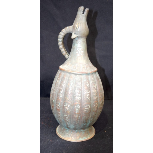 3192 - An Islamic silver and lead water jug.  33cm tall