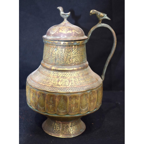 3193 - An Islamic bronze, silver and lead water jug.  28cm tall