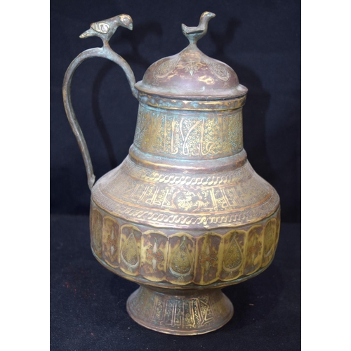 3193 - An Islamic bronze, silver and lead water jug.  28cm tall