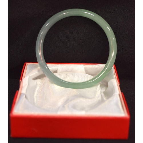 3210 - A Chinese jade bangle.  7.5cm