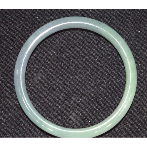 3210 - A Chinese jade bangle.  7.5cm