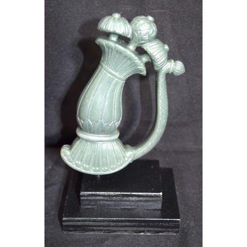 3226 - An Indian Jade dagger handle mounted on plinth. 15cm