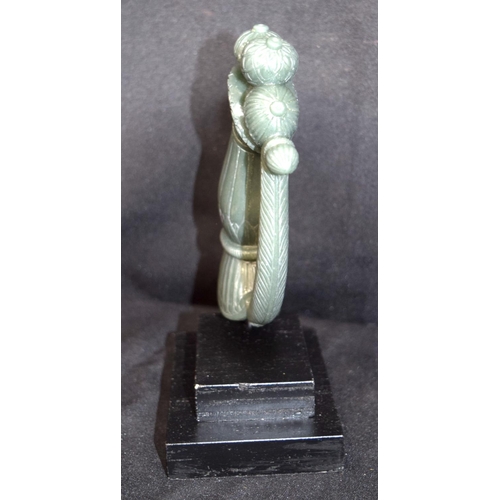 3226 - An Indian Jade dagger handle mounted on plinth. 15cm