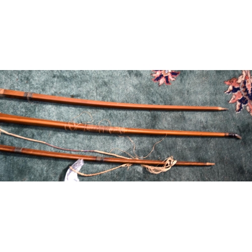 3235 - Three early 20th Century Archery bows.  largest 187cm long