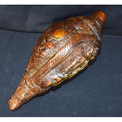 3243 - A Tibetan bronze snail shell decorated with figures.  24cm x 12 cm