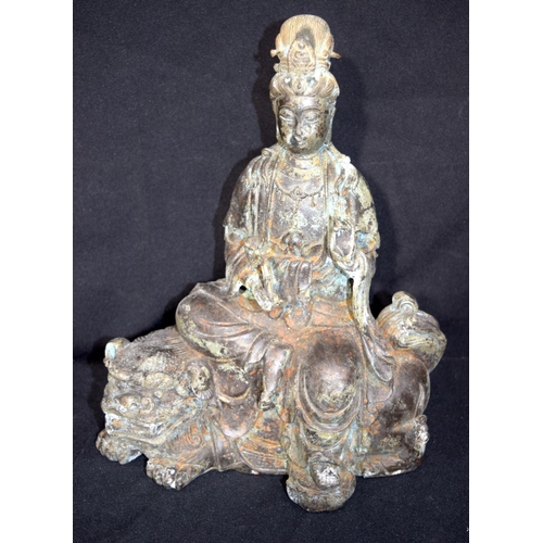 3244 - Chinese bronze Buddha seated on a beast.  Buddha 28cm high