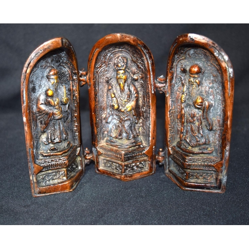 3246 - Bronze folding model of a Chinese temple opening to display three priests.  15cm high