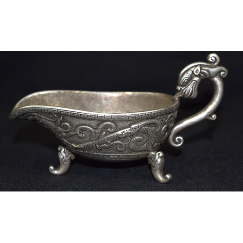 3279 - A Chinese white metal dragon Sauce Boat.  13cm