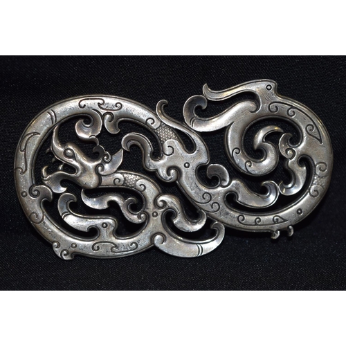 3282 - A Chinese white metal dragon Plaque.  11cm x 6 cm