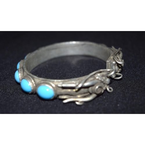 3288 - A Chinese White metal dragon Bangle with Turquoise stones