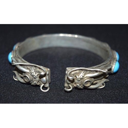 3288 - A Chinese White metal dragon Bangle with Turquoise stones