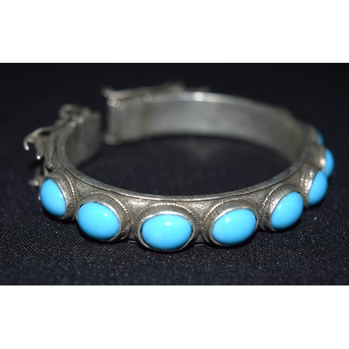 3288 - A Chinese White metal dragon Bangle with Turquoise stones