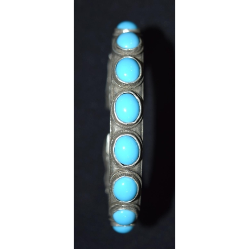 3288 - A Chinese White metal dragon Bangle with Turquoise stones