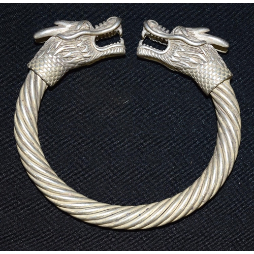 3294 - A Chinese white metal dragon bangle 9 x 9cm