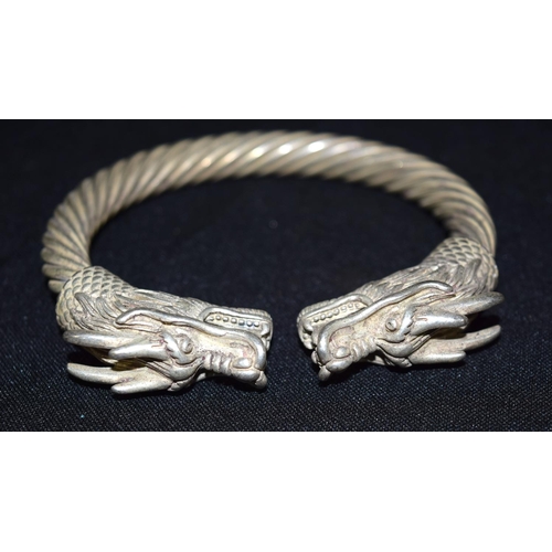 3294 - A Chinese white metal dragon bangle 9 x 9cm