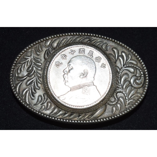 3299 - A Chinese white metal belt buckle with a mounted medallion 8.5 cm