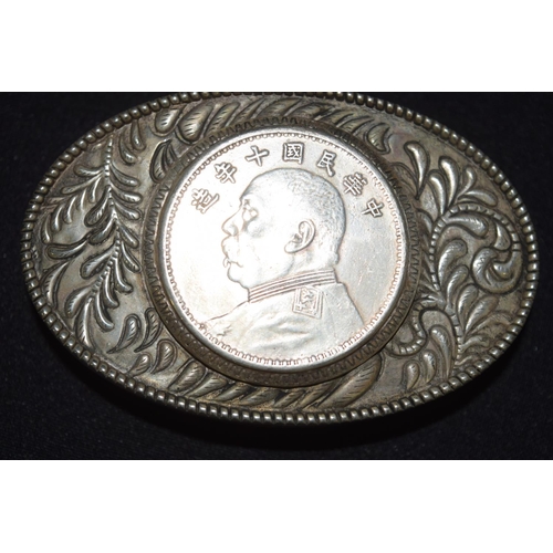 3299 - A Chinese white metal belt buckle with a mounted medallion 8.5 cm