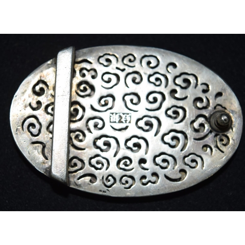 3299 - A Chinese white metal belt buckle with a mounted medallion 8.5 cm