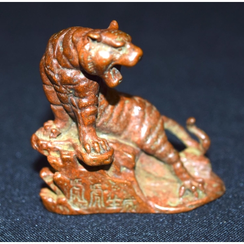 3339 - A small bronze Japanese  tiger on a rock 6 cm