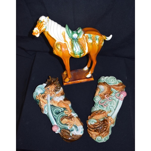 3377 - A  Chinese porcelain Tang horse and two Chinese dragon wall pockets