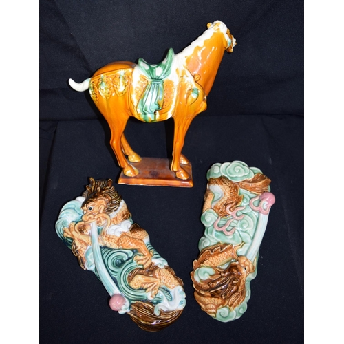 3377 - A  Chinese porcelain Tang horse and two Chinese dragon wall pockets