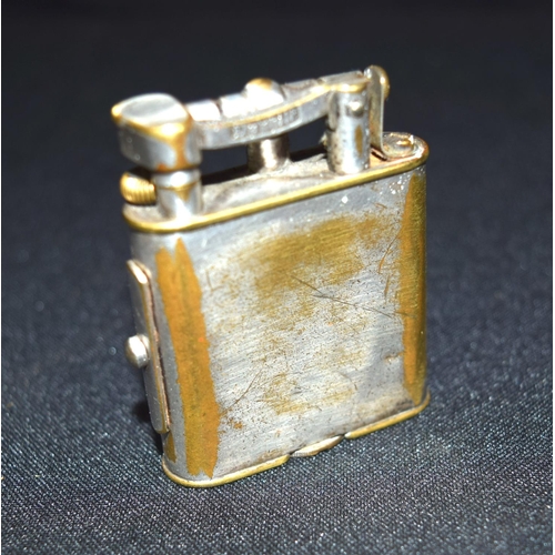 3393 - A vintage Dunhill lighter with side lock