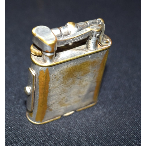 3393 - A vintage Dunhill lighter with side lock