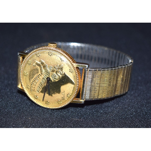 3394 - A yellow metal gents wrist watch depicting MU DU Liberty