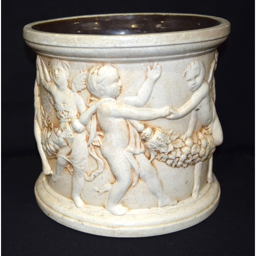 3409 - A Large Bretby pottery Jardiniere with cherubs moulded in classical style 27cm x 30cm