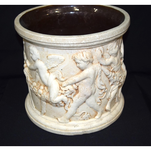 3409 - A Large Bretby pottery Jardiniere with cherubs moulded in classical style 27cm x 30cm