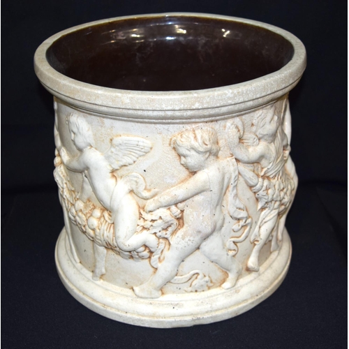 3409 - A Large Bretby pottery Jardiniere with cherubs moulded in classical style 27cm x 30cm