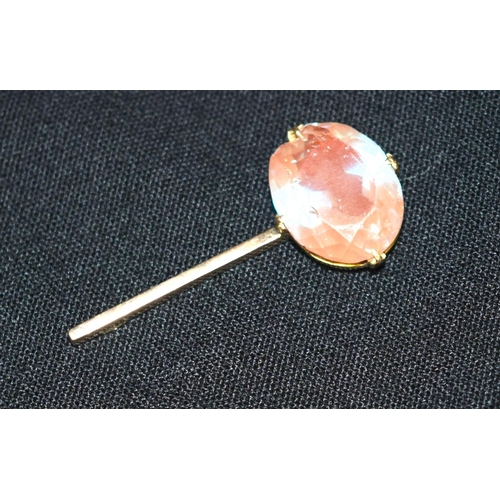 3415 - A large clear stone iridescent blue stone set in a yellow metal pin