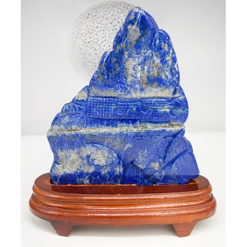 3465 - A Lapis lazuli carved boulder with stand 19cm x 14cm