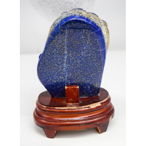 3466 - A Lapis lazuli carved boulder with stand 13 x 9 cm