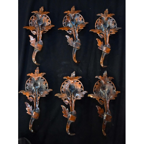 3473 - A group of Bronze Tibetan decorative wall fittings 36 cm