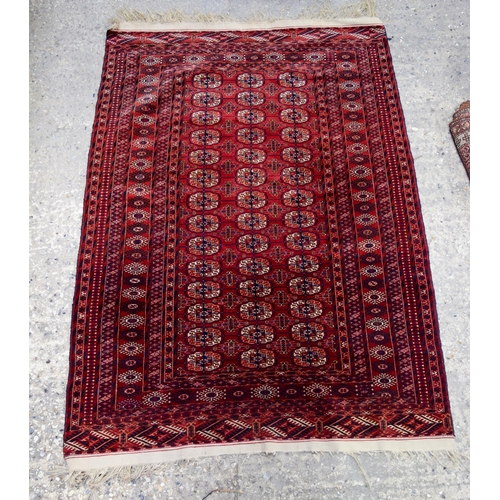 3140 - A Red ground Oriental rug.  176cm x 122cm