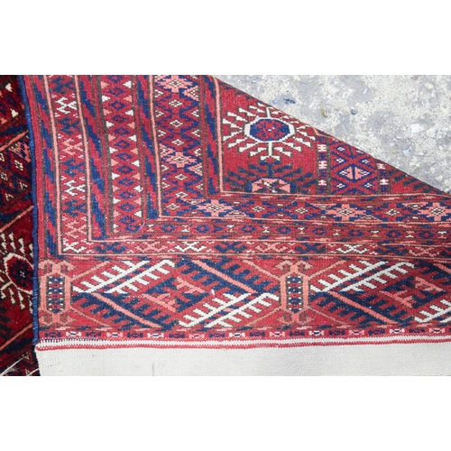 3140 - A Red ground Oriental rug.  176cm x 122cm