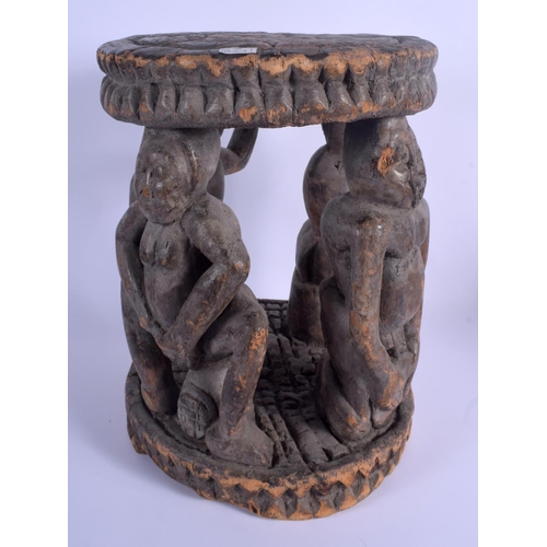 8 - AN EARLY 20TH CENTURY AFRICAN YORUBA TRIBAL STOOL formed with four opposing figures. 38 cm x 26 cm.