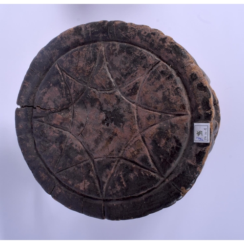 8 - AN EARLY 20TH CENTURY AFRICAN YORUBA TRIBAL STOOL formed with four opposing figures. 38 cm x 26 cm.