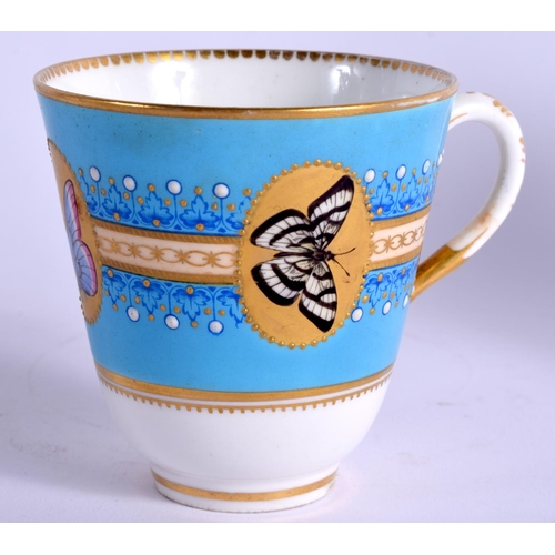 102 - A ROYAL WORCESTER TURQUOISE GROUND CUP AND SAUCER decorated with butterflies in gilt panels and a gi... 