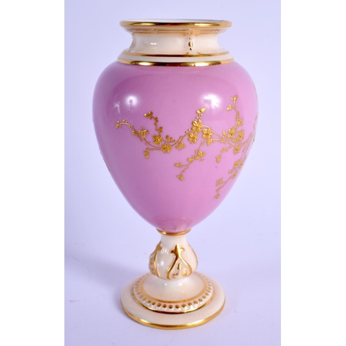 136 - A ROYAL WORCESTER PEDESTAL VASE with rose pompadour ground gilded flowering trailing plants, shape 2... 